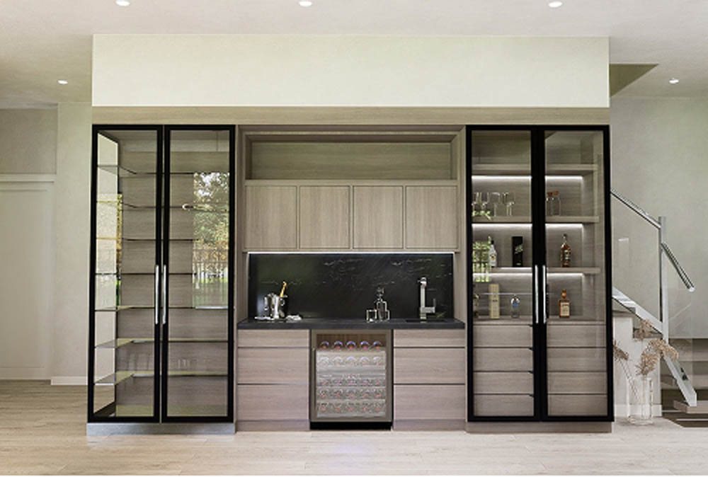 Neutral colored wine cellar and bar in front of staircase