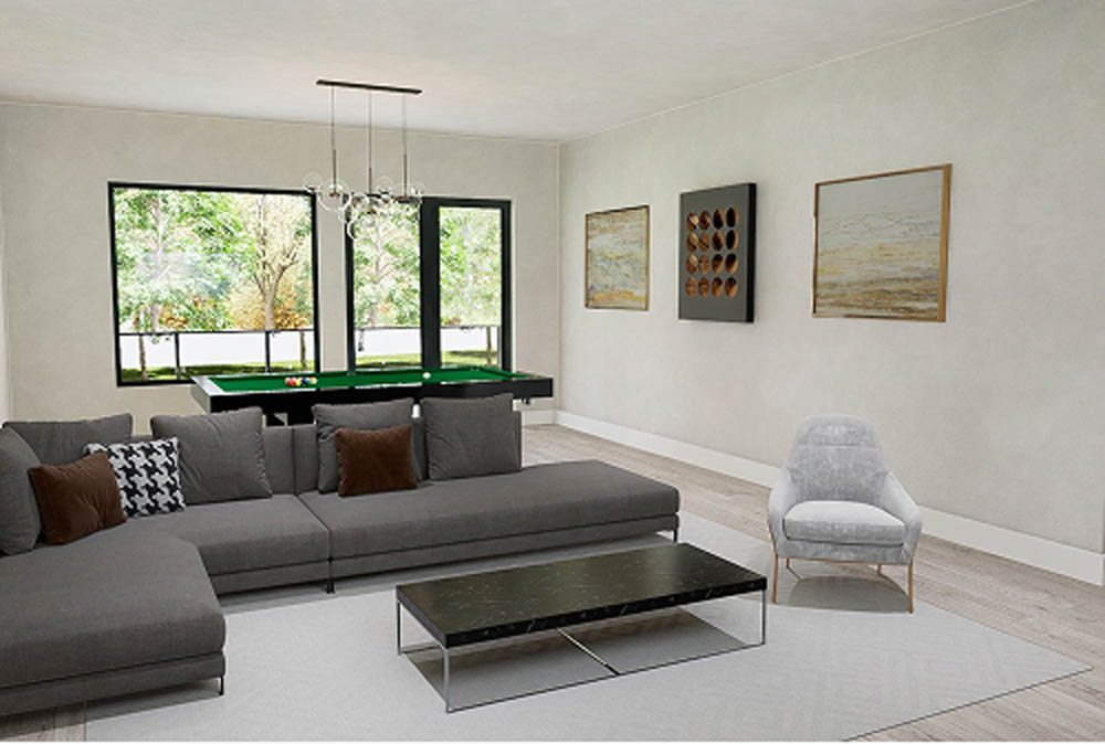 Living area with grey couch in front of pool table